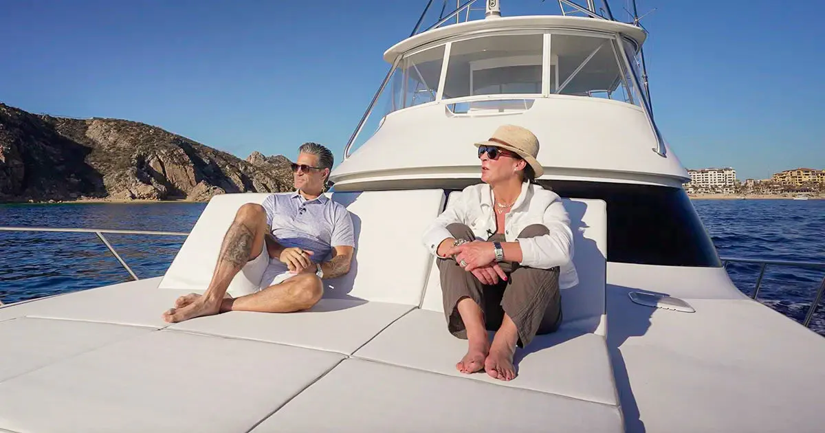 Ian Gengos and a Realm Global representative enjoying a private yacht experience in Los Cabos, reflecting the luxury lifestyle featured in Realm’s Location Luxe article