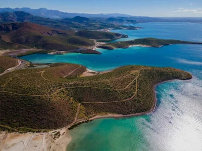Aerial view of a rare waterfront land parcel in Baja California Sur, featured in Haute Residence and represented by Ian Gengos for luxury development and investment opportunities