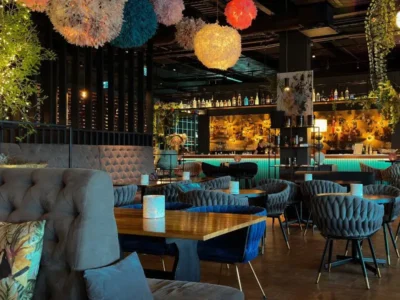 Modern restaurant interior in Baja California Sur with stylish seating, ambient lighting, and a contemporary bar showcasing the region’s elevated dining scene.